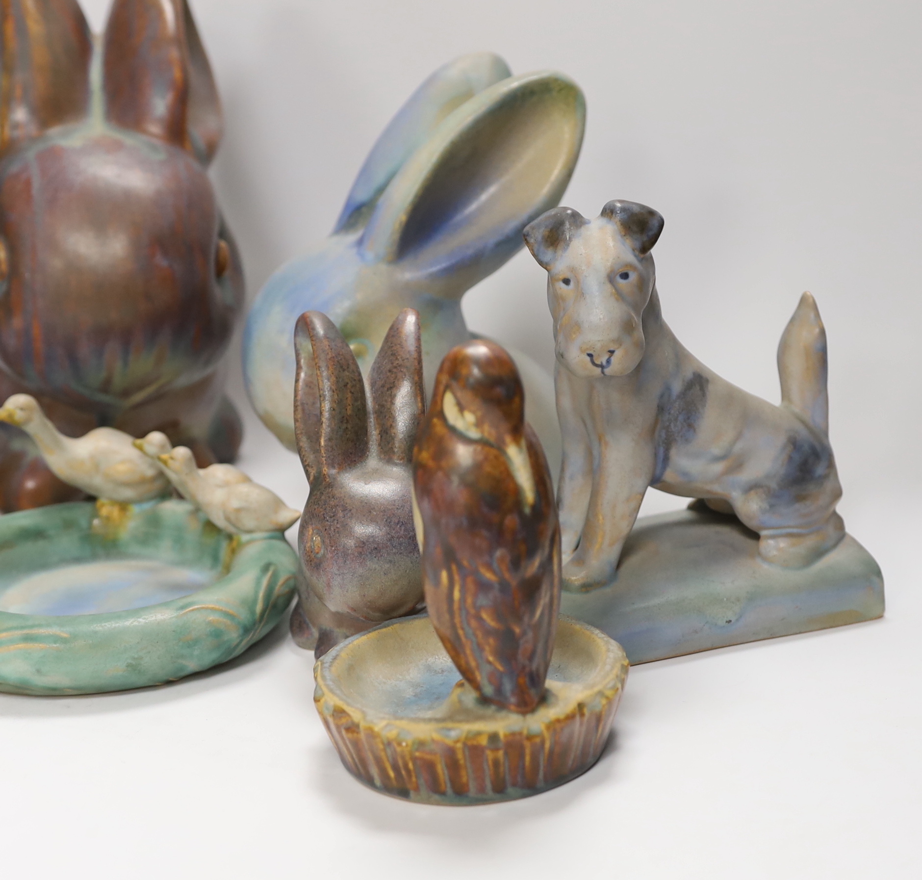 Collection of Bourne Denby animals including rabbits and a pair of dogs, tallest 27cm